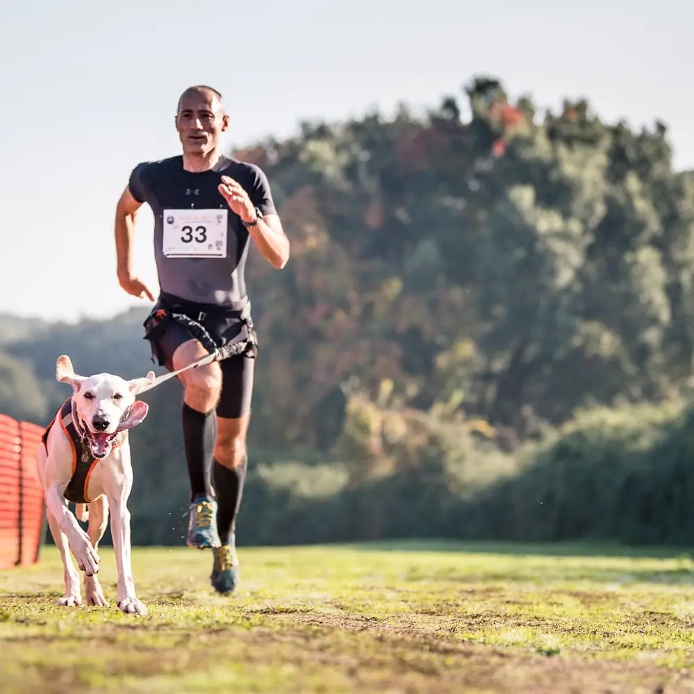 Man running with dog